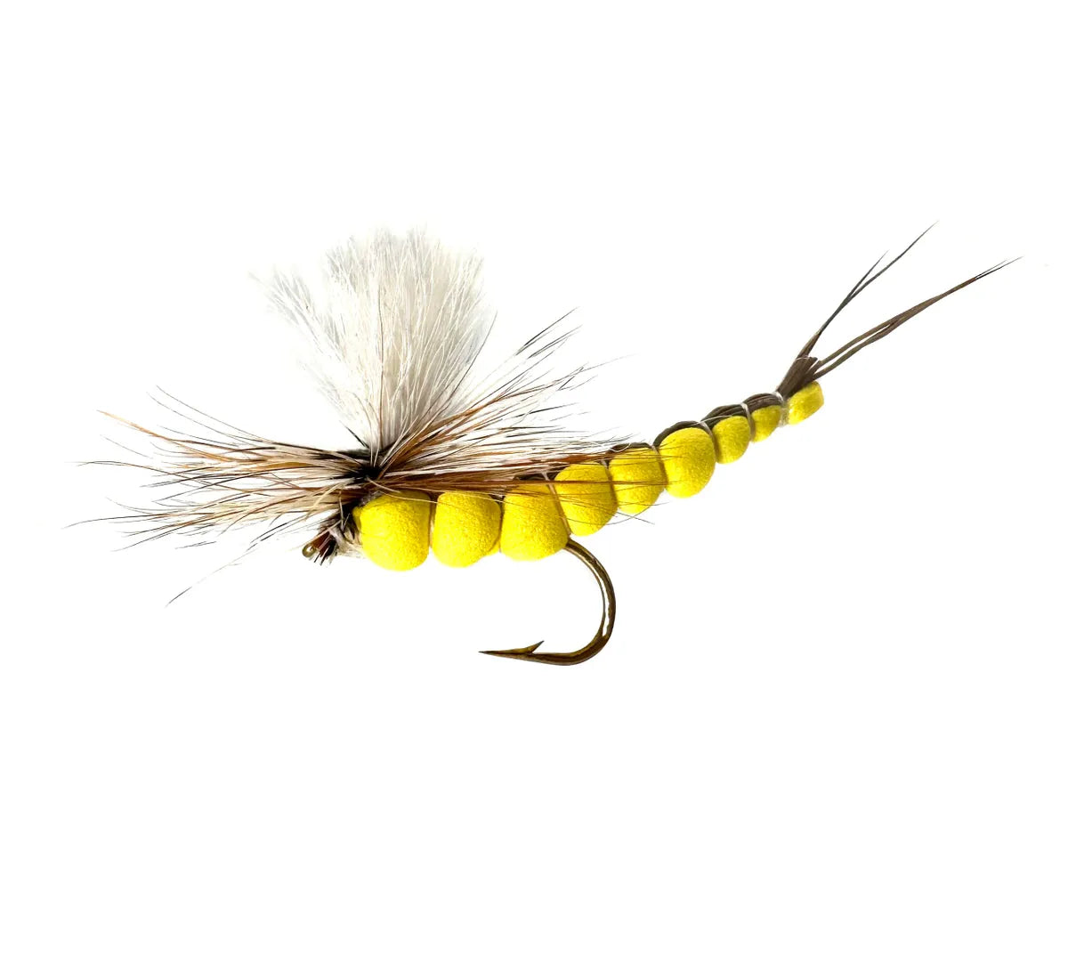 A close-up photograph showing three Extended Body Hex Parachute Dry Flies in sizes #6, #8, and #10. The flies feature realistic segmented foam extended bodies, brown parachute hackle, and a high-visibility white wing post, tied on barbed hooks.