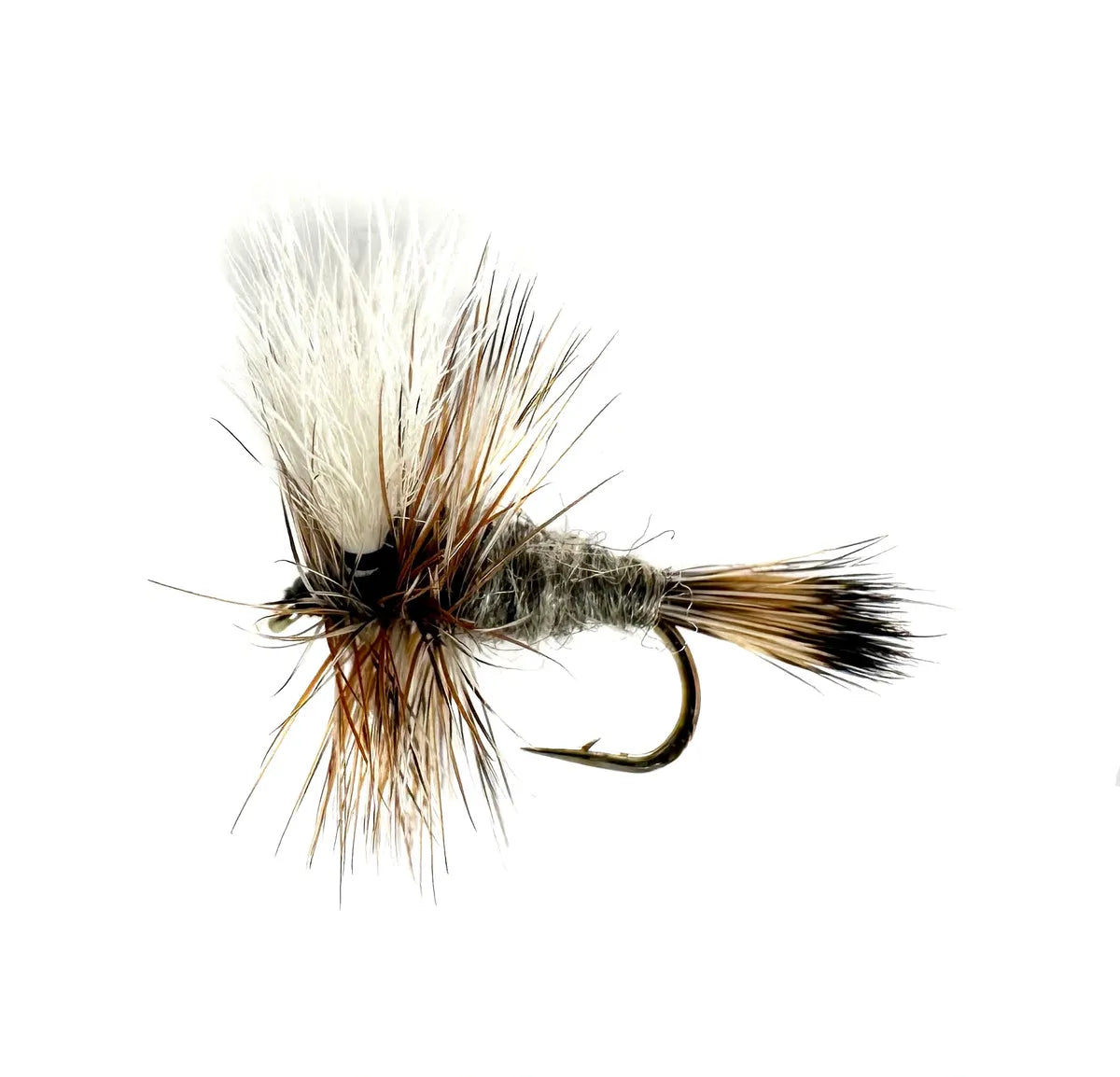 A close-up photograph showing the Adams Wulff Dry Fly in sizes #12, #14, #16, and #18. The flies feature durable hair wings and tails, a mixed gray/grizzly body, and hackle, tied on barbed hooks for a high-floating presentation in fast water.