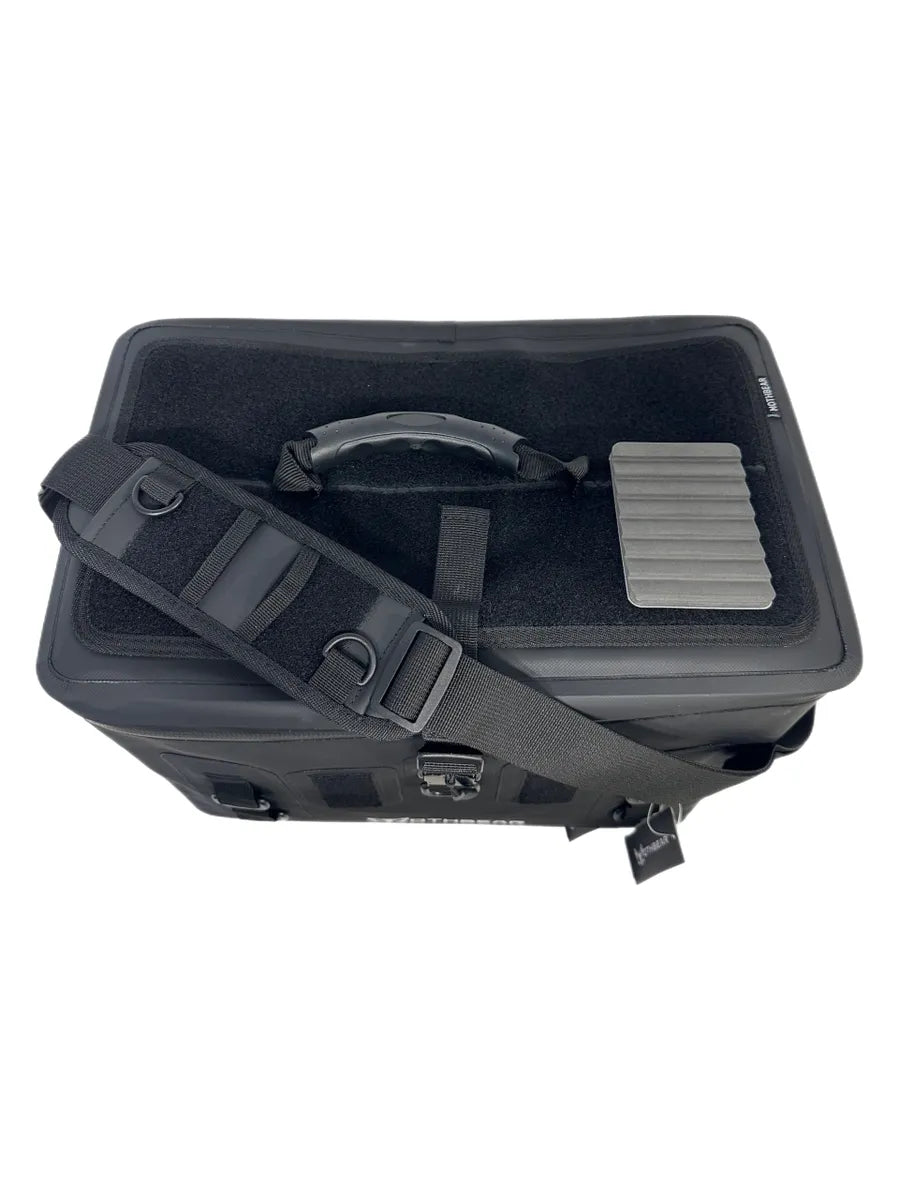 The Black Series Boat Bag: 32L waterproof boat bag showing black 840DTPU material and top handle.
Black Series 32L boat bag: Waterproof fishing gear tote with shoulder strap and magnetic lid clip.